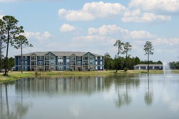 A large building with a fountain in front of it.